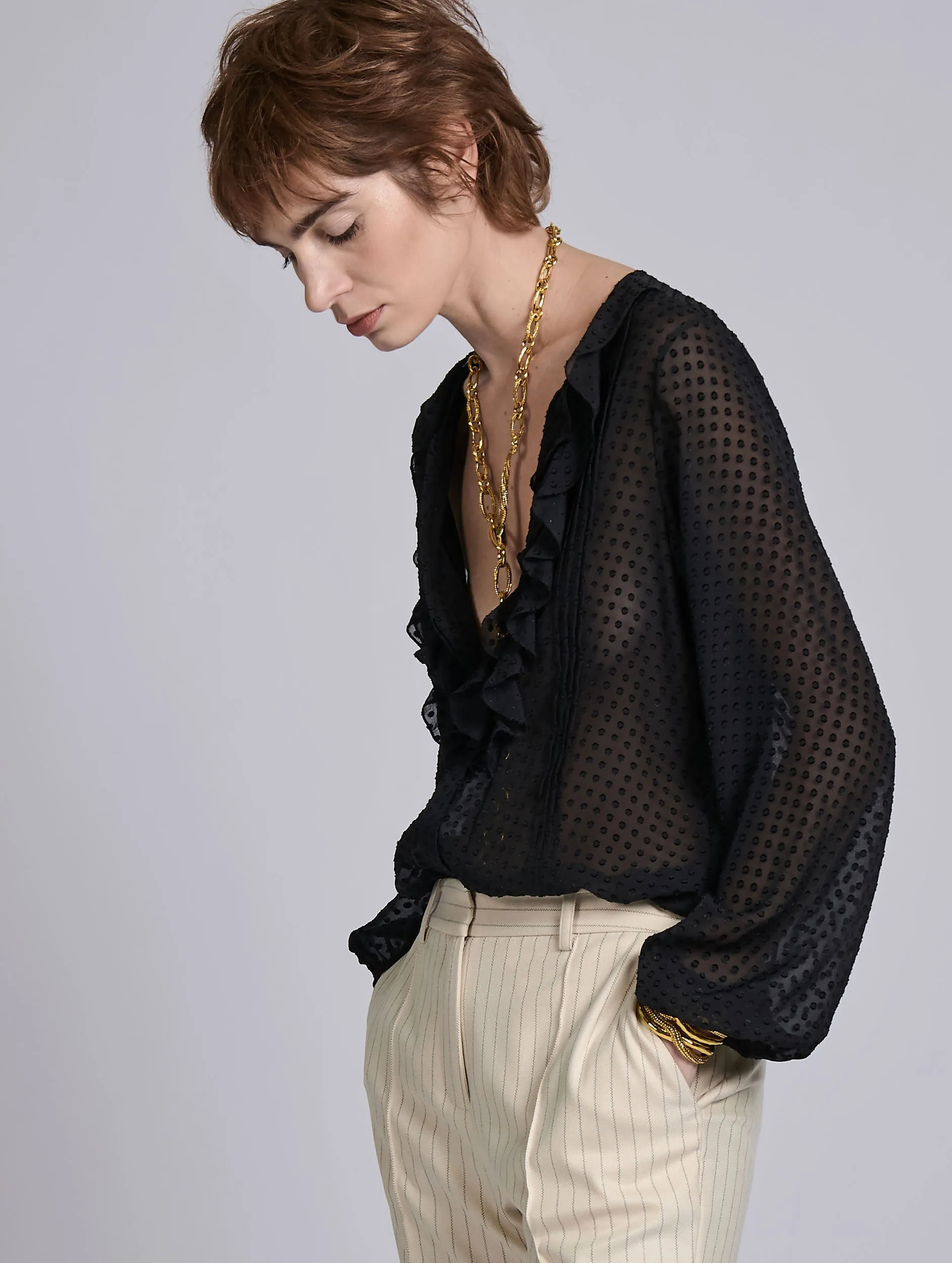 Sleek Stretch No Shrink Fabric Black ruffled blouse in jacquard plumetis